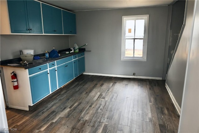 laundry room featuring dark wood-type flooring