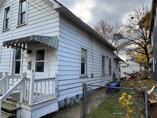 view of property exterior with fence