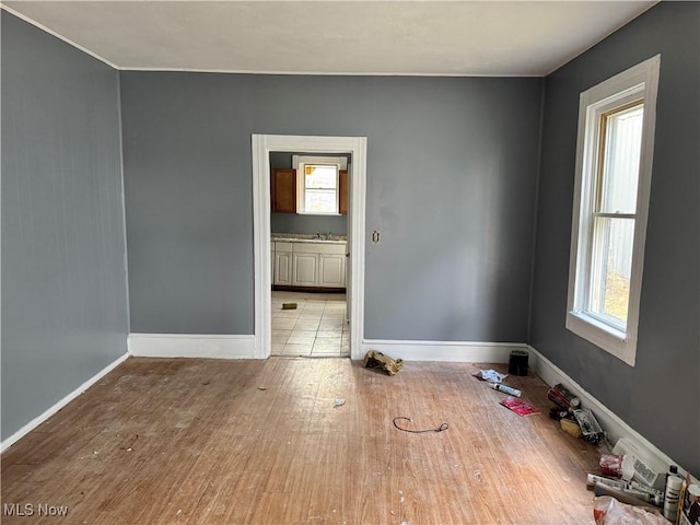 empty room with light hardwood / wood-style floors