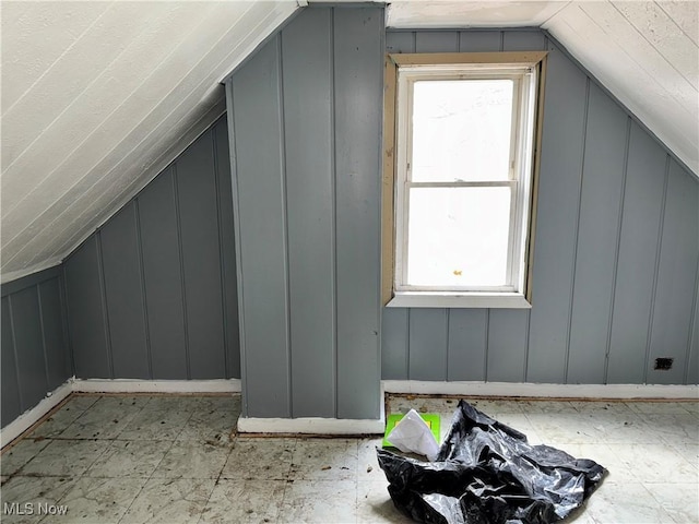 additional living space with vaulted ceiling