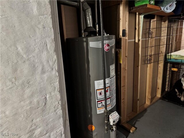 utility room featuring gas water heater