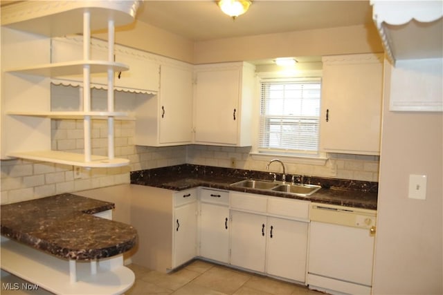 kitchen with dishwasher, white cabinetry, sink, and tasteful backsplash