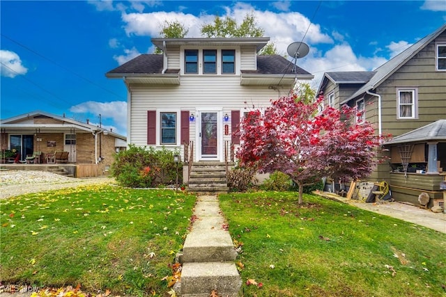 bungalow-style home featuring a front lawn