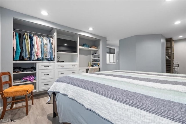 bedroom featuring a closet and light hardwood / wood-style flooring