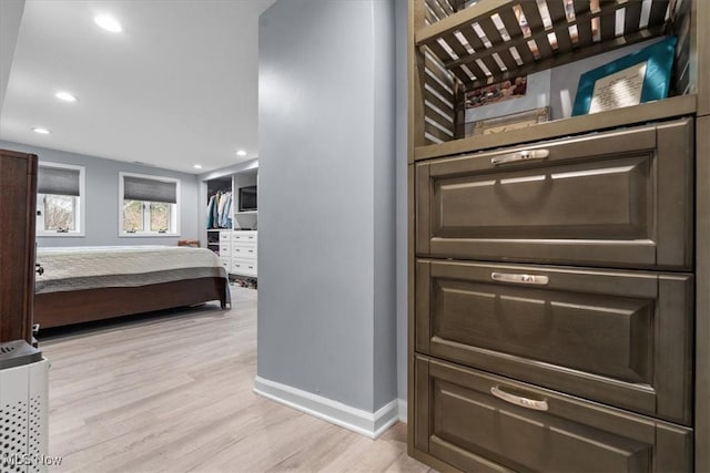 bedroom with light hardwood / wood-style floors