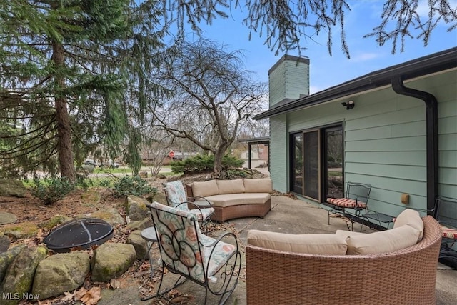 view of patio / terrace featuring an outdoor living space with a fire pit