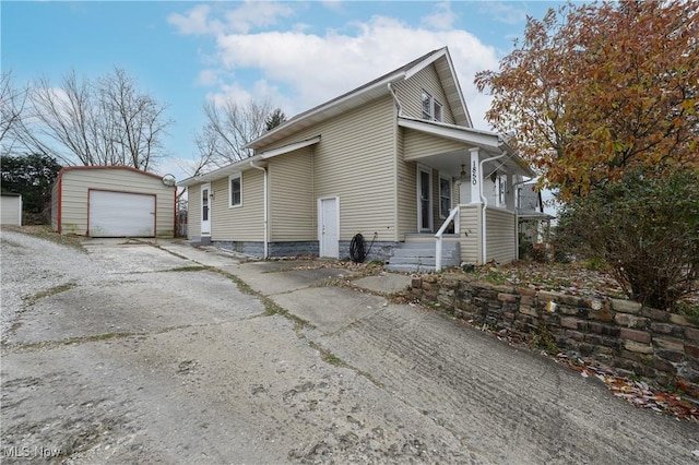 view of home's exterior featuring a garage and an outdoor structure