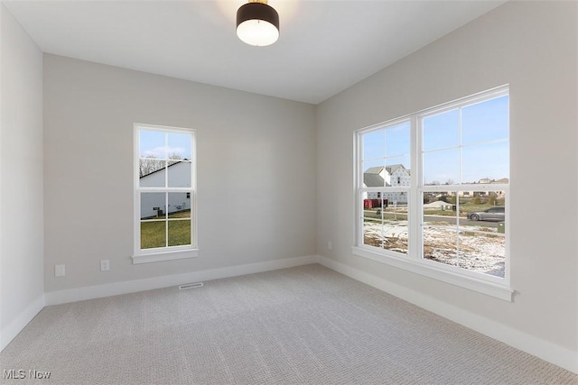 583 Iris Pl, Aurora, OH 44202 - unfurnished room featuring plenty of natural light and carpet floors