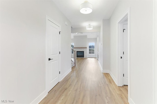 hall with light hardwood / wood-style flooring