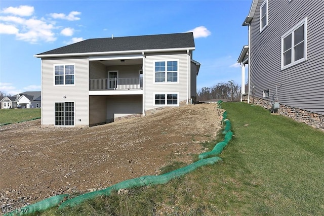 583 Iris Pl, Aurora, OH 44202 - back of house with a balcony and a lawn