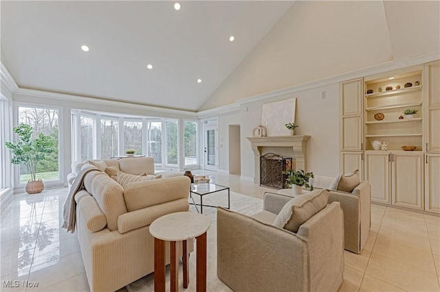 tiled living room featuring plenty of natural light and high vaulted ceiling