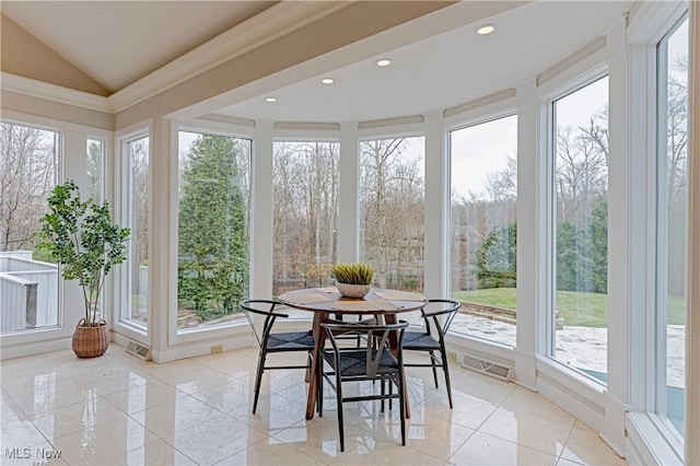 sunroom featuring lofted ceiling