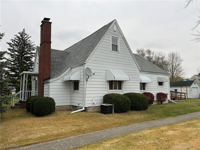 view of home's exterior with a lawn