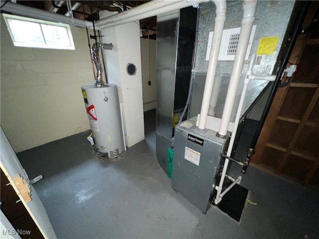 utility room featuring gas water heater