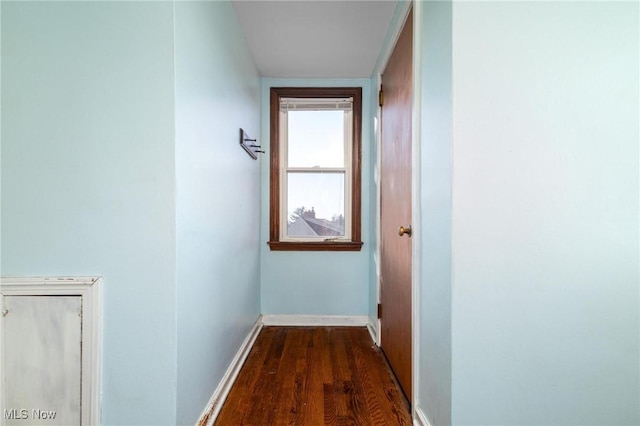 hallway featuring dark wood-type flooring