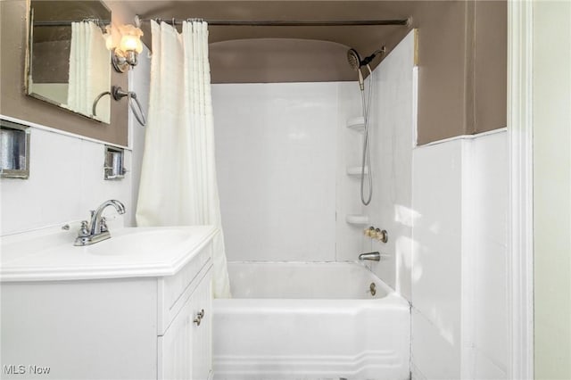 bathroom with shower / bath combination with curtain and vanity