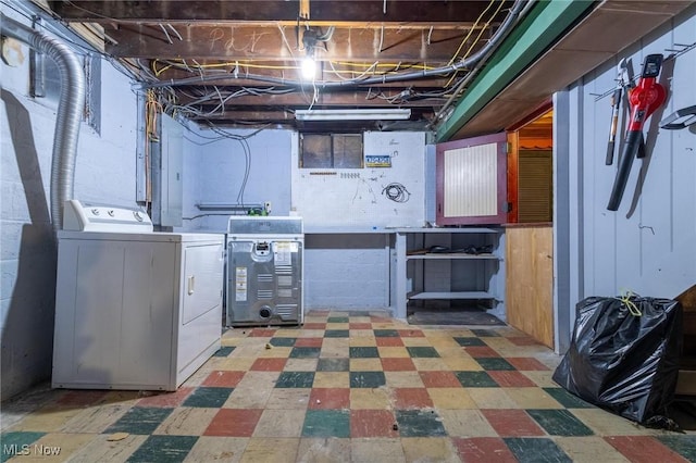 basement featuring washer / dryer and a workshop area