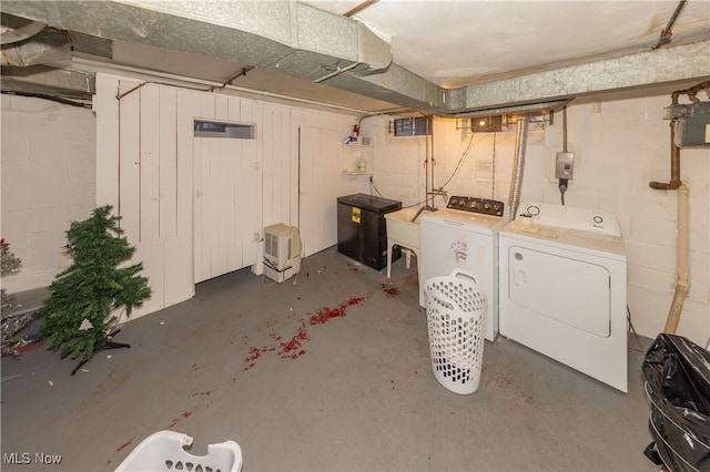 basement with washing machine and clothes dryer