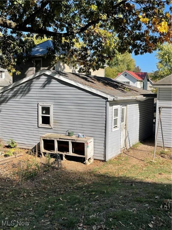 view of property exterior featuring a yard