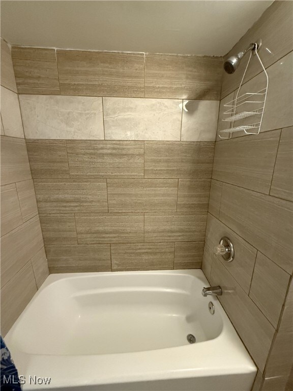 bathroom featuring washtub / shower combination