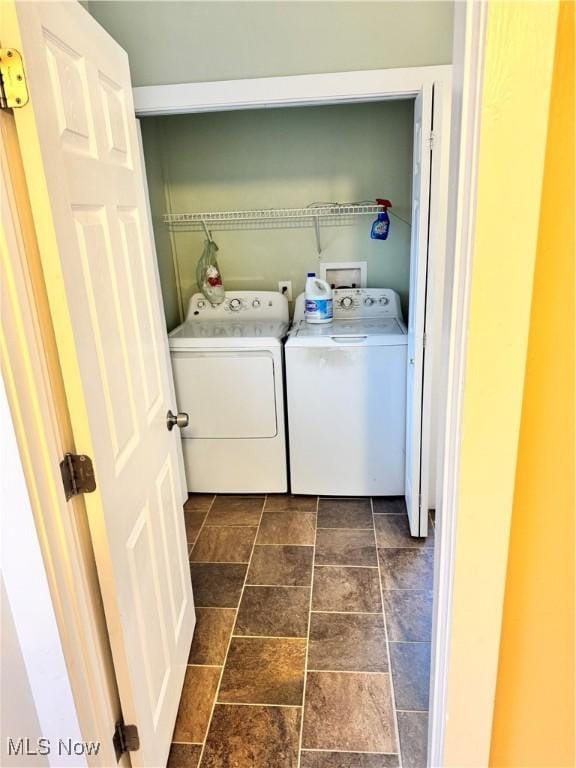 laundry area featuring washing machine and clothes dryer