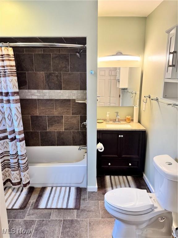 full bathroom with vanity, toilet, and shower / bath combo