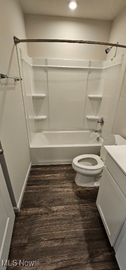 full bathroom with hardwood / wood-style floors, vanity, shower / bathtub combination, and toilet