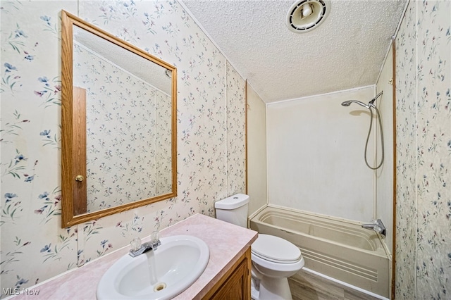 full bathroom featuring hardwood / wood-style floors, shower / bathing tub combination, vanity, toilet, and a textured ceiling