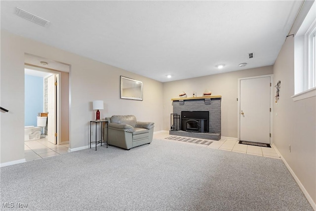 carpeted living room featuring a wood stove