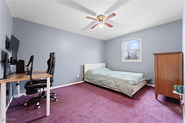 carpeted bedroom with ceiling fan and a textured ceiling