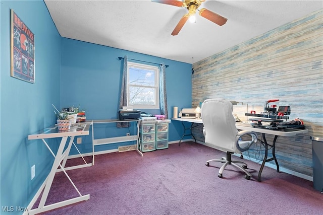 office space featuring carpet and ceiling fan