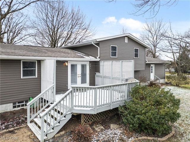 rear view of house with french doors and a deck