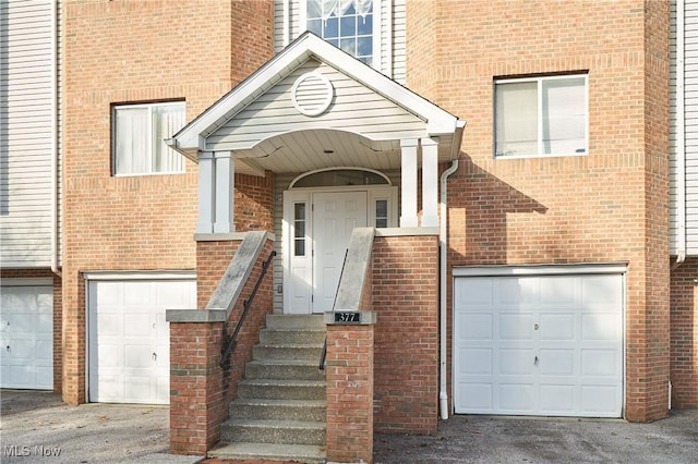 doorway to property featuring a garage