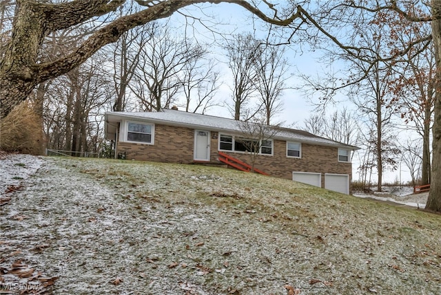 ranch-style house featuring a garage