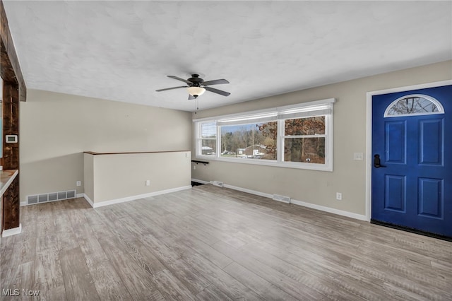 entryway featuring ceiling fan and light wood-type flooring