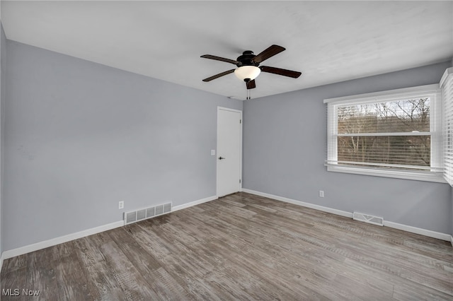 unfurnished room featuring ceiling fan and light wood-type flooring