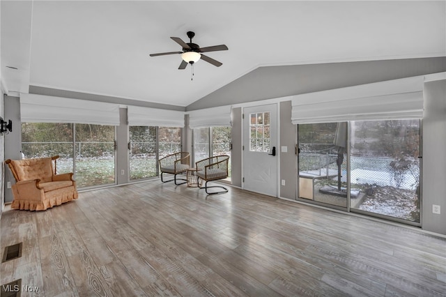 unfurnished sunroom featuring vaulted ceiling and ceiling fan