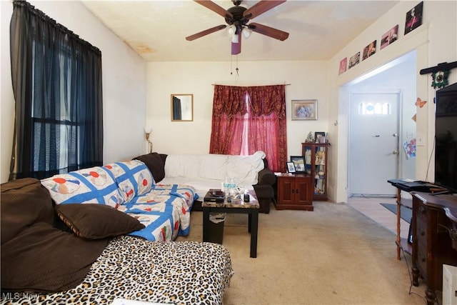 living room with light carpet and ceiling fan