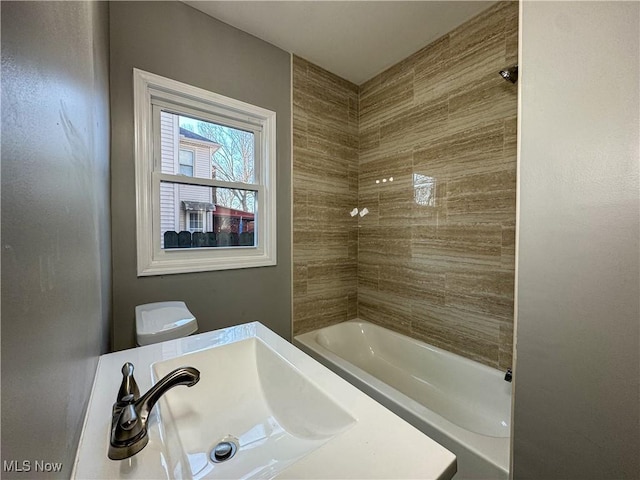 full bathroom with  shower combination, toilet, and sink