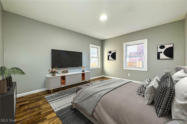 bedroom featuring dark hardwood / wood-style flooring