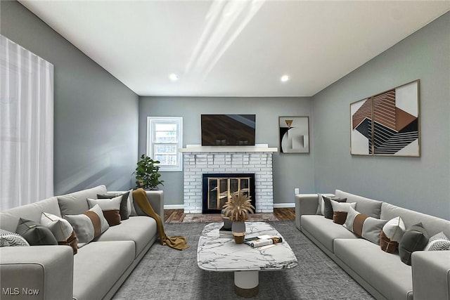 living room featuring hardwood / wood-style floors and a fireplace