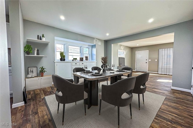 dining space with dark wood-type flooring