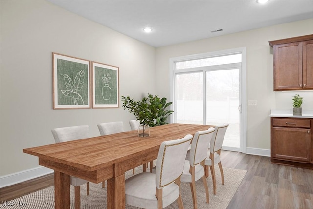 dining room with light hardwood / wood-style floors