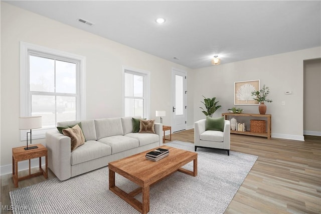 living room with light hardwood / wood-style floors