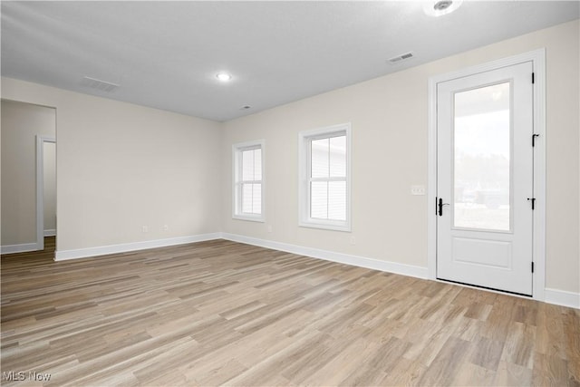 spare room with light wood-type flooring