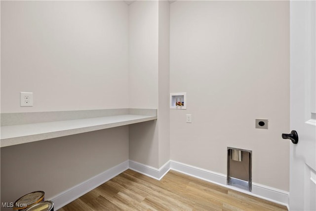 washroom with electric dryer hookup, light wood-type flooring, and hookup for a washing machine