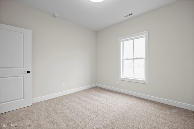 unfurnished room with carpet flooring