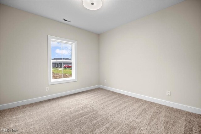 view of carpeted spare room