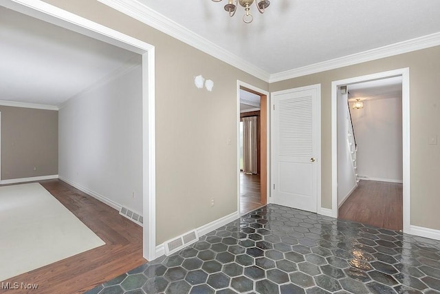 corridor with dark wood-type flooring, a notable chandelier, and ornamental molding