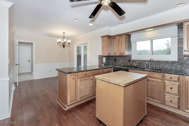 kitchen featuring plenty of natural light, a kitchen island, and dark wood-type flooring